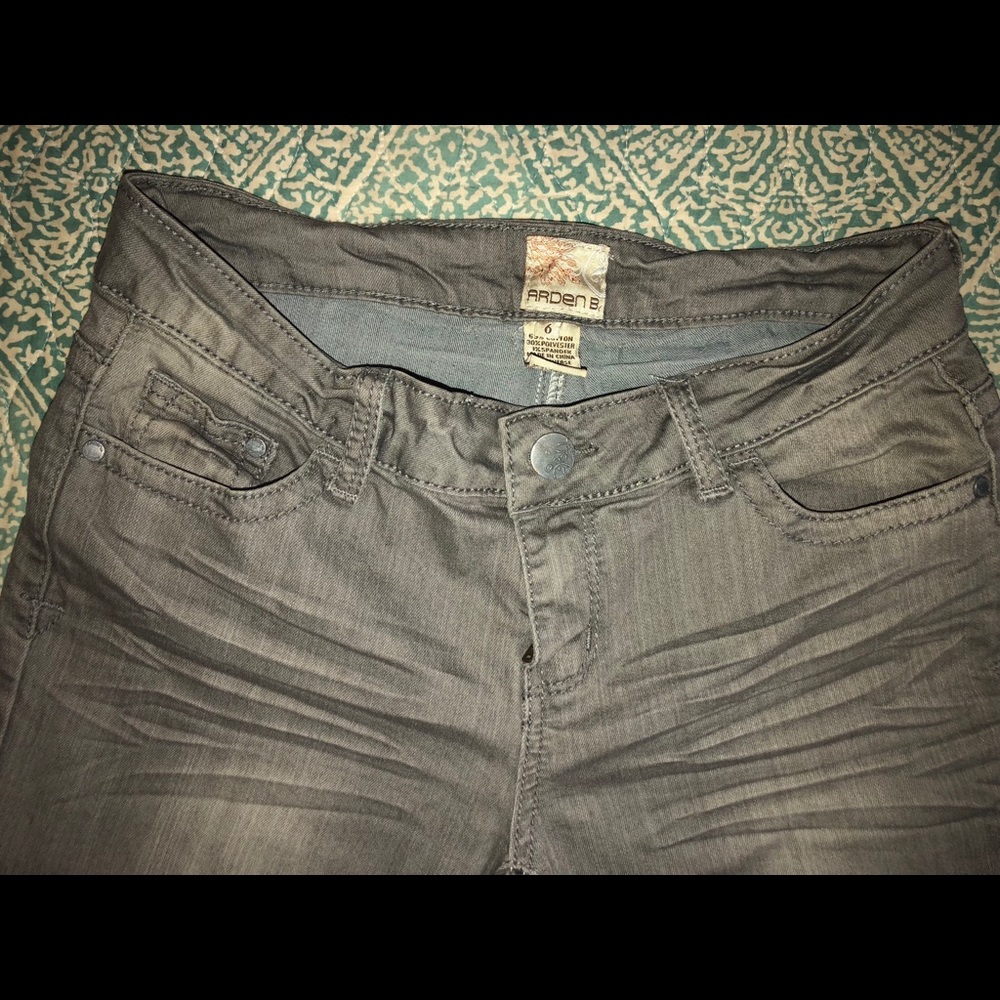 Grey skinny jeans with ankle zipper detail